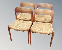 A set of four 20th century teak framed rattan upholstered chairs.