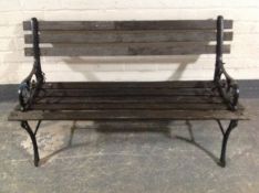 Two wrought iron wooden slatted garden benches