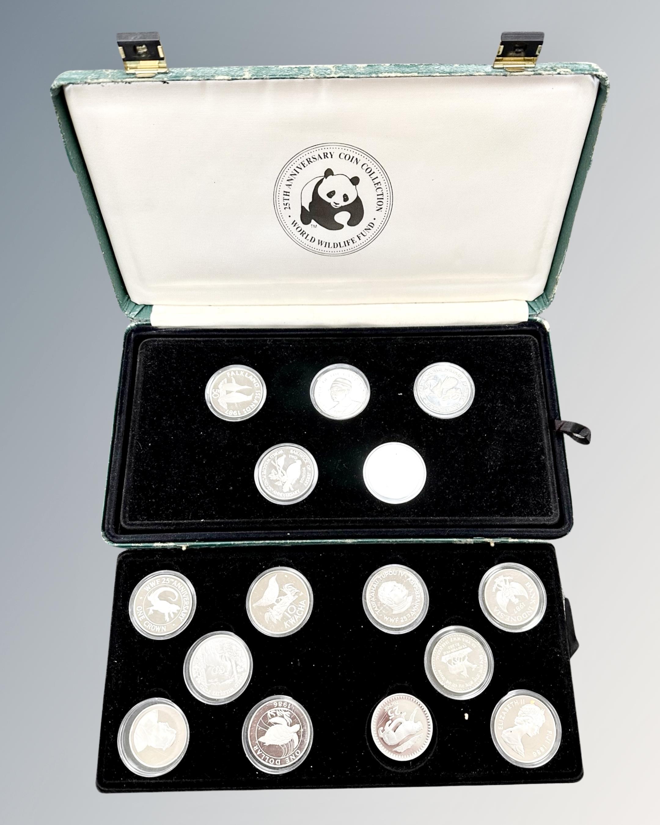 A World Wildlife fund 25th Anniversary coin collection, 25 silver proof coins, cased.