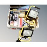 A box containing a pair of work lights, a car boot organizer, a mini LED projector,