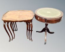 A beech nest of three tables together with a drum table.