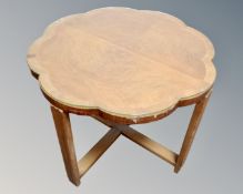 A 1930's walnut and beech shaped glass topped coffee table