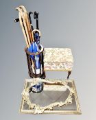 A sewing box on legs together with a stick stand containing assorted walking sticks and umbrellas,