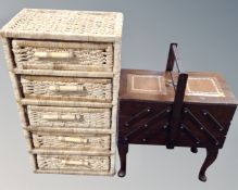 A concertina sewing box on legs together with a wicker five drawer chest.