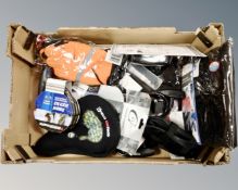 A box containing bicycle accessories including gel seat, bike lock, Thinsulate gloves, waterproofs,