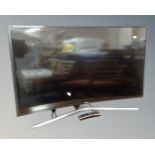 A Samsung Smart Curve TV model UE40JU6740U, with remote.