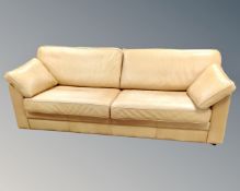 A late 20th century Scandinavian Skalma tan leather upholstered three seater settee.
