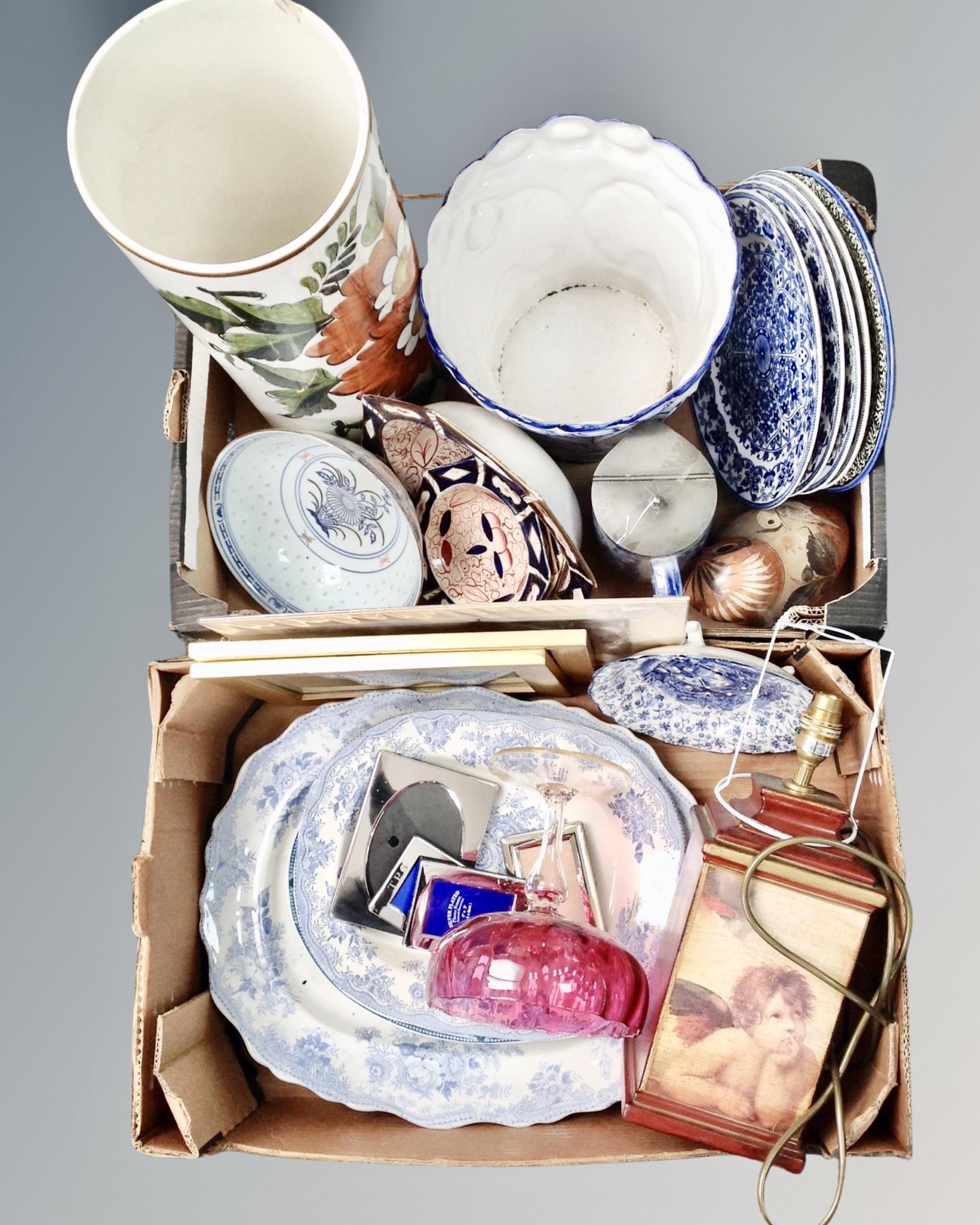 Two boxes containing antique and later blue and white ceramics, a cranberry glass bowl on stand,