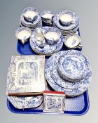 Two trays containing Wedgwood Italian tea and dinnerware with matching place mats and coasters.