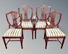 A set of four reproduction shield back dining chairs.