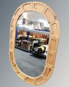 A large Danish pine oval wall mirror.