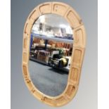 A large Danish pine oval wall mirror.