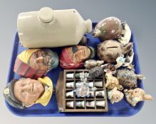 A tray containing stoneware, hot water bottle, china thimbles on stand, Wade tortoises,