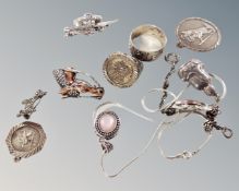 A group of silver and marcasite jewellery including horse head brooch, coin inset ring,