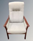 A stained beech framed high back manual reclining armchair