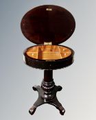 A 19th century mahogany oval pedestal worktable.