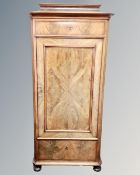 A 19th century continental flame mahogany sentry door cabinet.