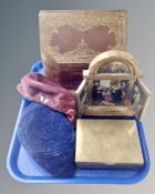 A tray containing a leather bound desk box, folding religious icon, brass cigarette box,