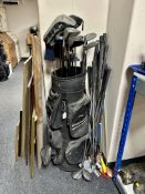 A Datrek golf bag containing a quantity of assorted golfing irons, drivers,