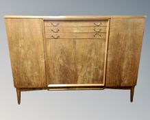 A Scandinavian beech sideboard fitted with drawers and cupboards.