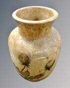A 20th century pottery vase decorated with thistles.
