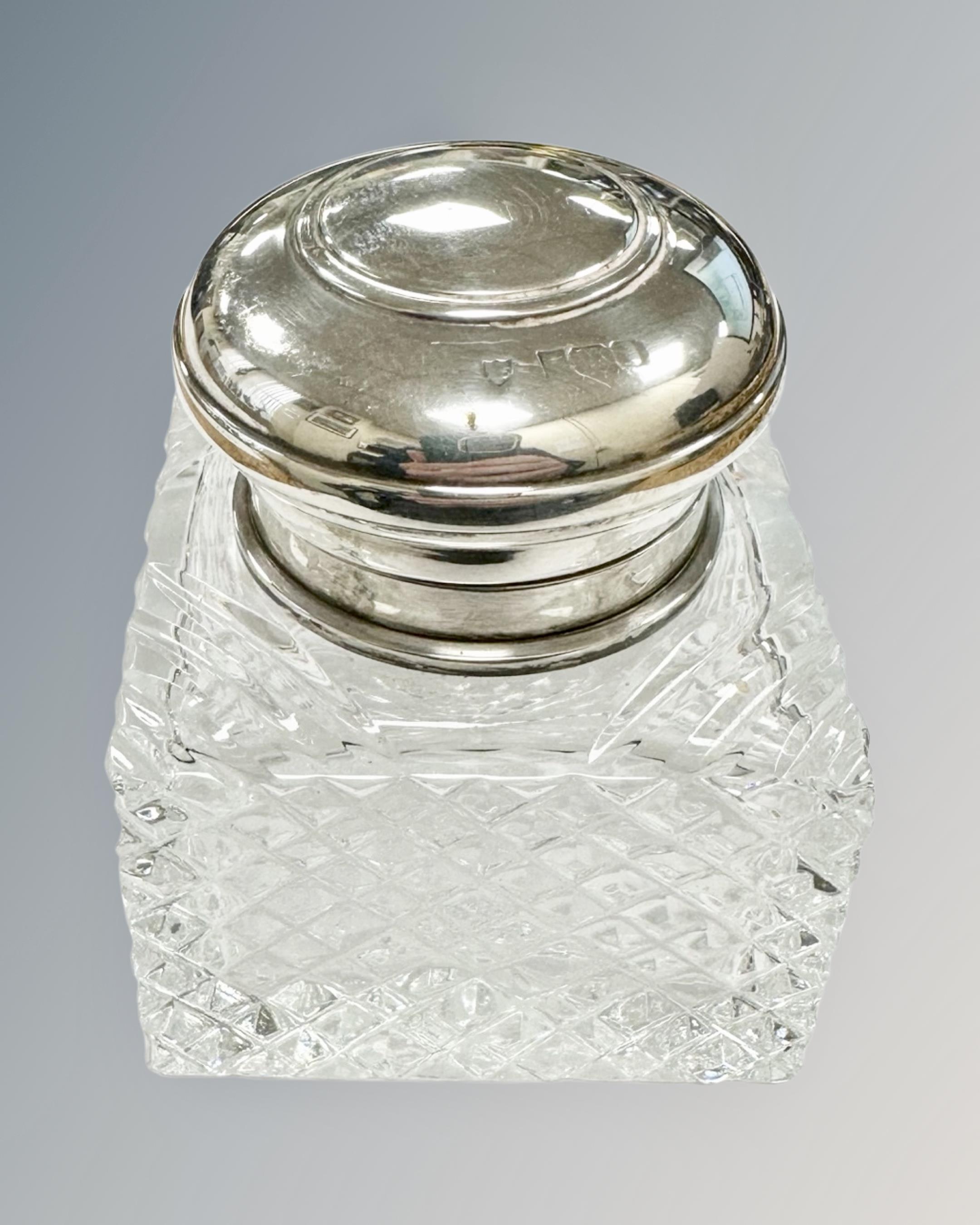 A silver-topped crystal inkwell, height 7.