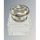 A silver-topped crystal inkwell, height 7.