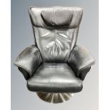 A Hjort Knudsen black stitched leather swivel armchair on circular chrome base.