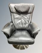 A Hjort Knudsen black stitched leather swivel armchair on circular chrome base.