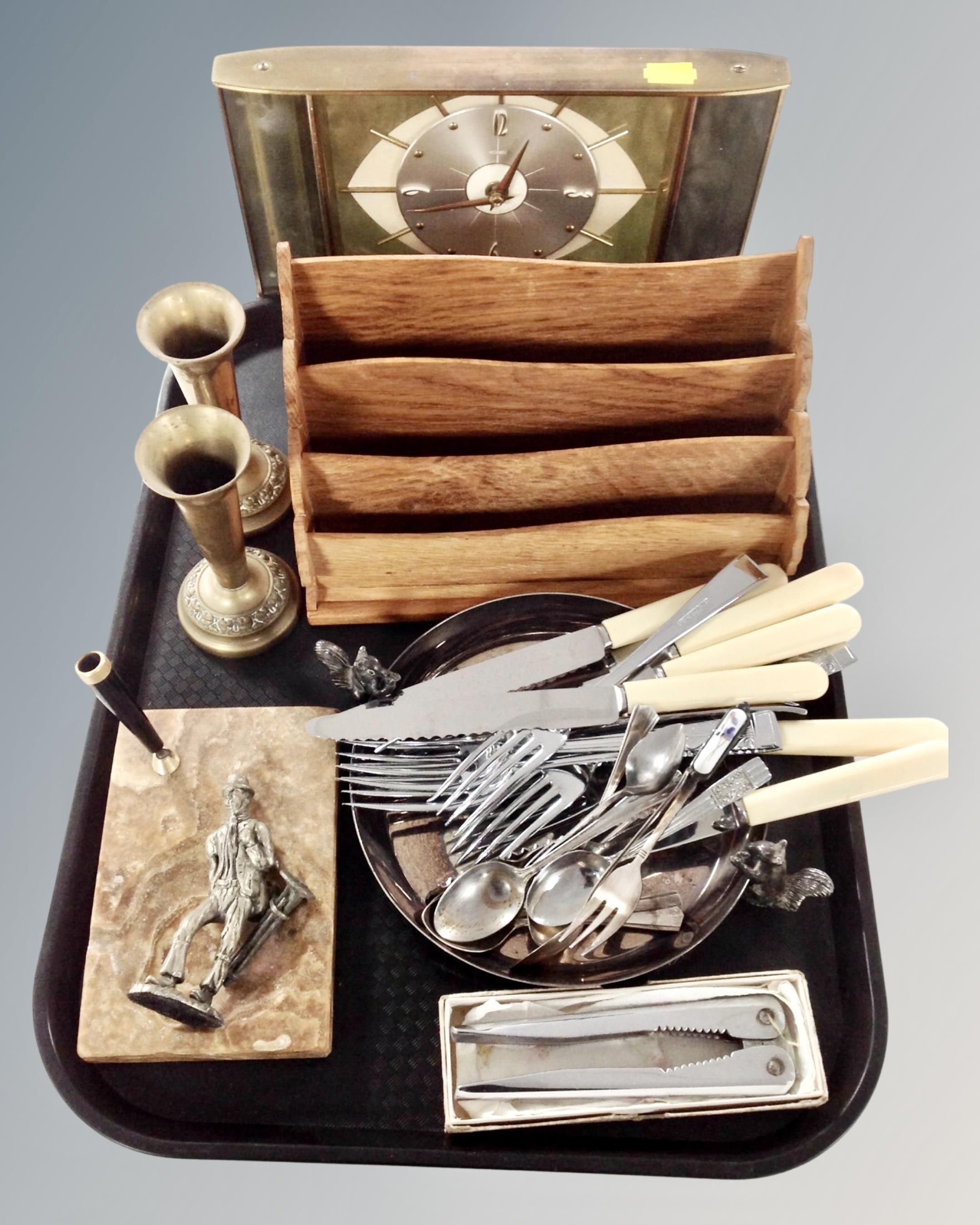 A tray containing mid-century Metamec mantel clock, wooden letter rack, plated cutlery, brass vases,