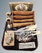 A tray containing mid-century Metamec mantel clock, wooden letter rack, plated cutlery, brass vases,