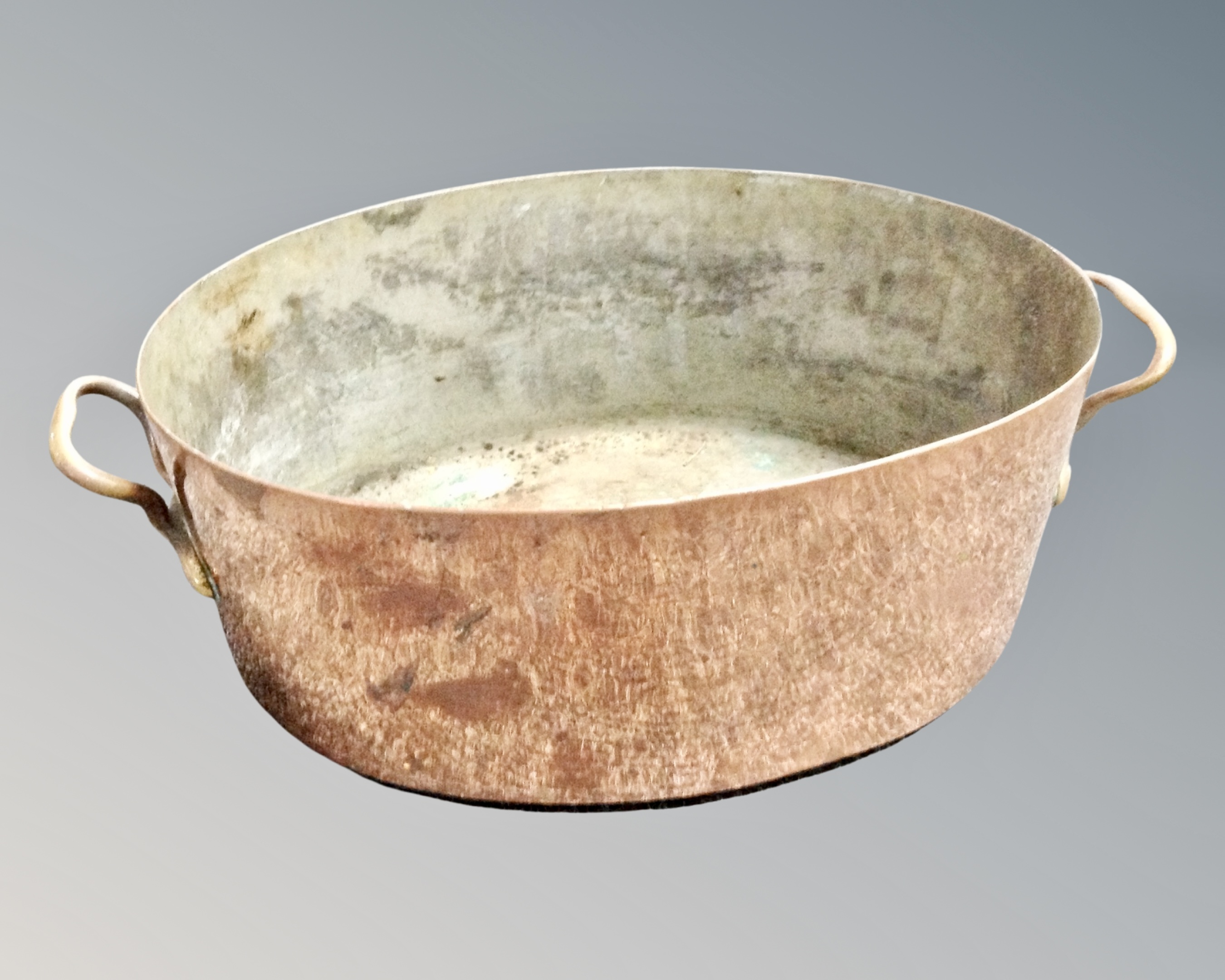 A George III oval copper brass handled pan.