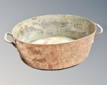 A George III oval copper brass handled pan.