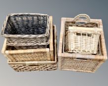Seven assorted wicker baskets.