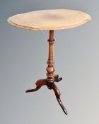 A 19th century mahogany pedestal table with shaped top.