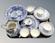 A tray containing eight pieces of Spode willow pattern and Italian blue and white china,