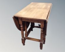A 20th century oak gate leg table