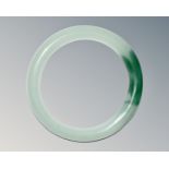 A carved jade circular bangle, inner diameter 58mm.