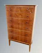 A 20th century Scandinavian walnut chest of six drawers.