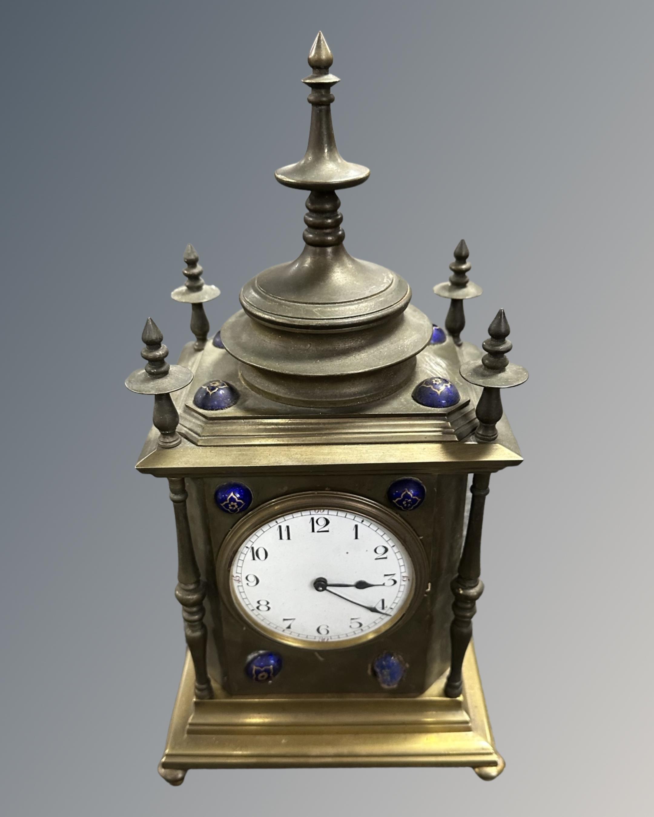 A decorative brass bracket clock.