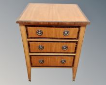 A satinwood veneered contemporary three drawer chest.
