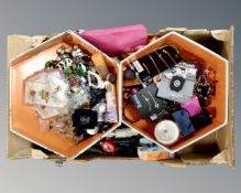 A box containing a quantity of assorted costume jewellery and beauty products.