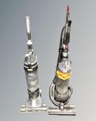 A Dyson DC 25 ball vacuum together with a Vax Mach Air pets and family upright vacuum.