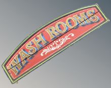 A painted washrooms sign.