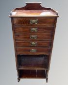 A 19th century mahogany five drawer music cabinet