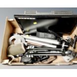 A box containing a miniature metal detector, cameras, camera tripods,