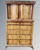A 19th century continental flame mahogany double door drinks cabinet,