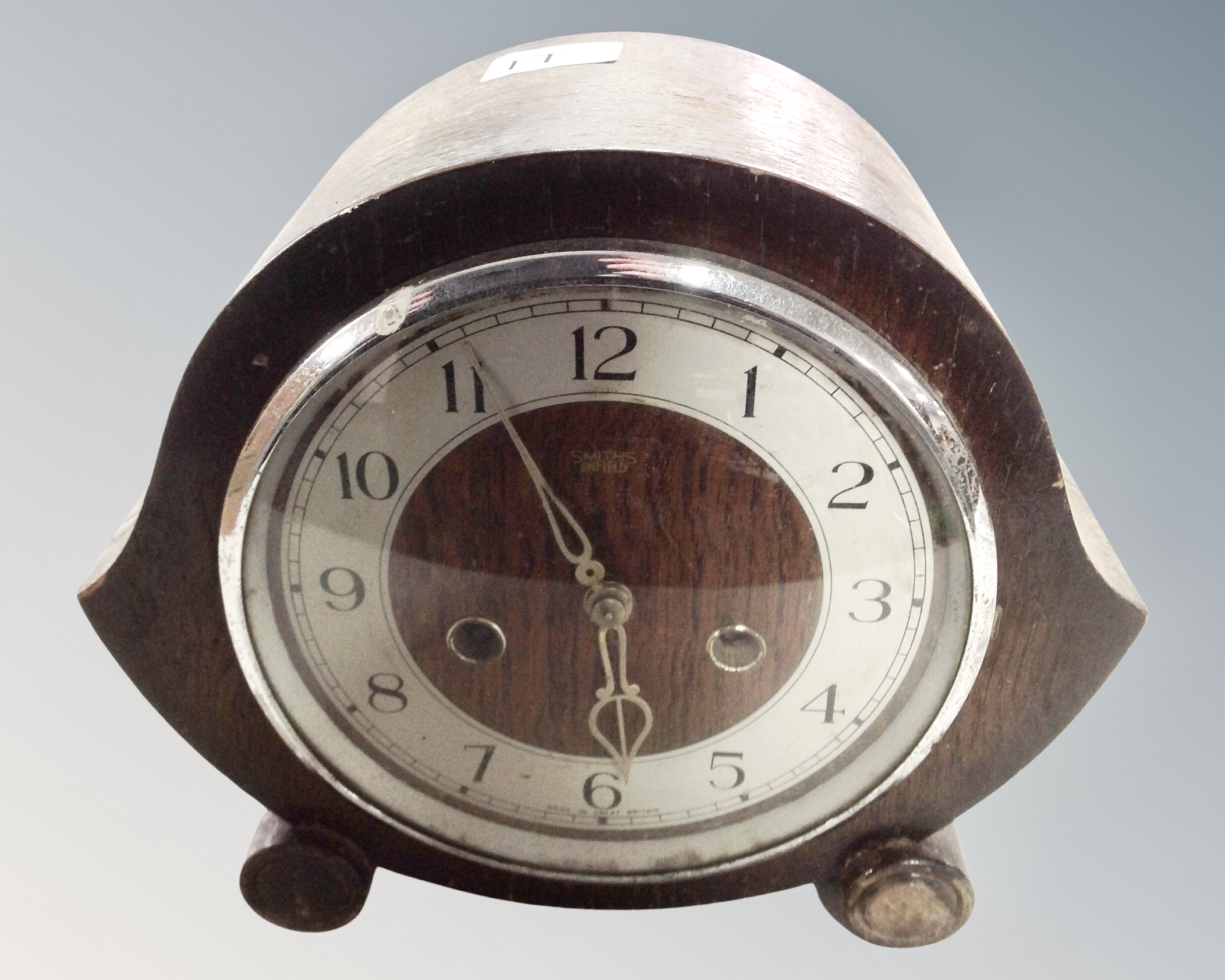A 1930s oak cased eight-day mantel clock.