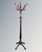 An early 20th century stained beech hat and coat stand
