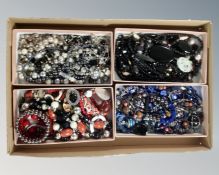 A tray containing a quantity of gemstone, glass and ceramic costume necklaces and bracelets.